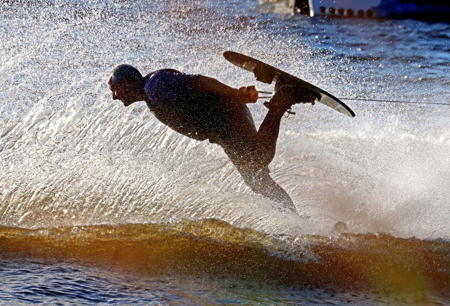 a water skier skis backwards