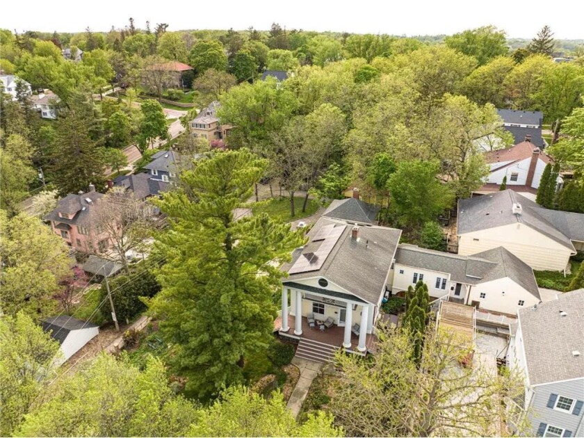 A historic Neoclassical home sits in the treetops of Rochester's Pill ...