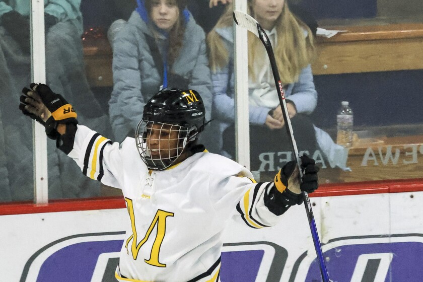 high school girls play ice hockey