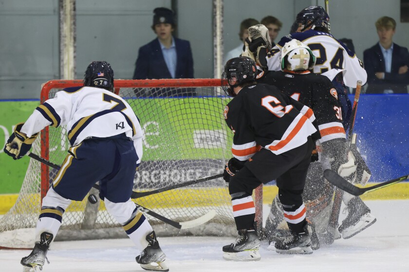 high school boys play hockey