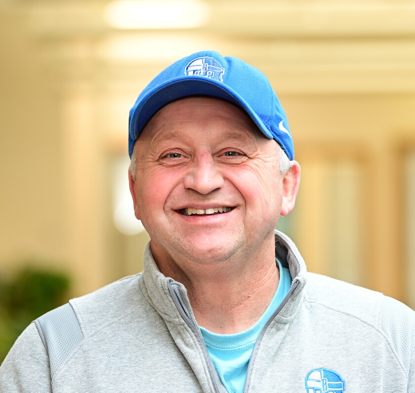 A man smiles