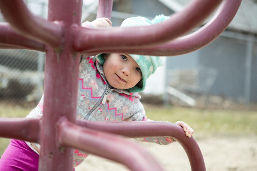 Mackenzie Runia, 2, climbs on a piece of playground equipment at Canigo Park on Thursday, April 28, 2022, in Willmar.