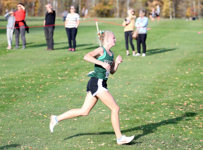 Proctor’s Lizzy Harnell (5085) runs past spectators on her second lap during her second place finish at the Lake Superior Conference meet