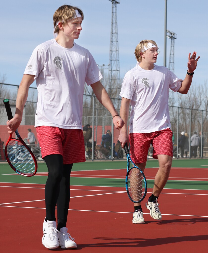 Trojans Ian Barber (on left) and Alec Langerud switch sides during a set against Yellow Medicine East during Worthington boys tennis invitational with Yellow Medicine East, Pipestone Area and Lac qui Parle Valley Saturday Morning.
