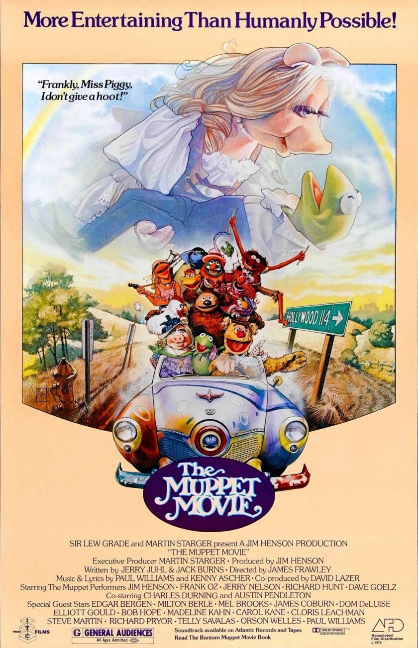 Theatrical release poster for "The Muppet Movie" features illustration of many Muppets packed into a convertible car, with Miss Piggy and Kermit swooning above.
