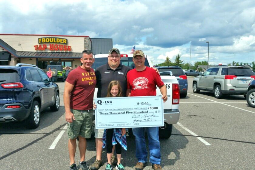 Jeff Bisson and Bob Hannas, who formed Q-ing for Communities to conduct events to honor local veterans, present a check for $3,500 to Paul Pederson, president of Minnesota Assistance Council for Veterans. Submitted photo