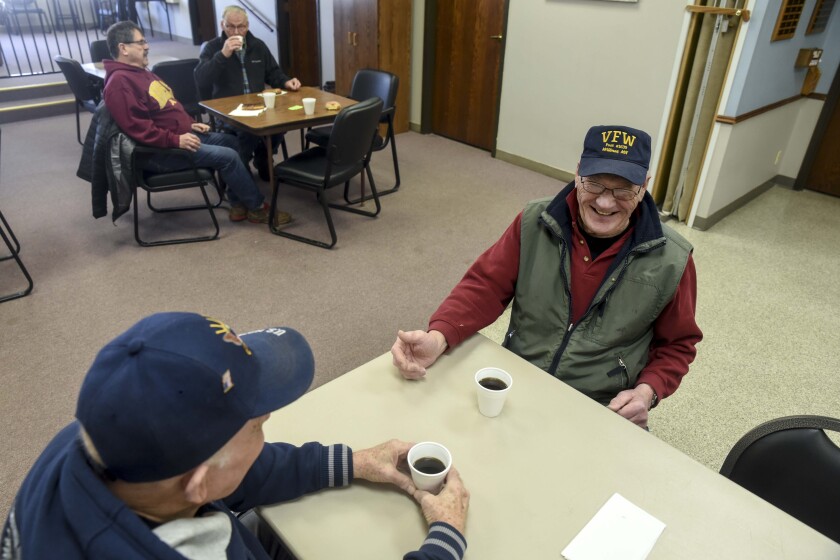 Erica Dischino/Tribune veteran Leonard Isdahl, right, enjoys coffee with colleague Doug Ardoff at the Coffee with Vets meetup at the Willmar Community Center Monday. The bi-monthly meetings are well attended and Monday was hosted by US Representative Collin Peterson.