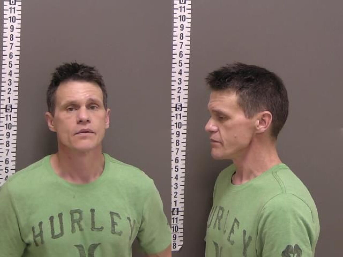 Photo: inforum.com A white man in a green Hurley brand t-shirt stands 5-foot-5 in a jail booking photo