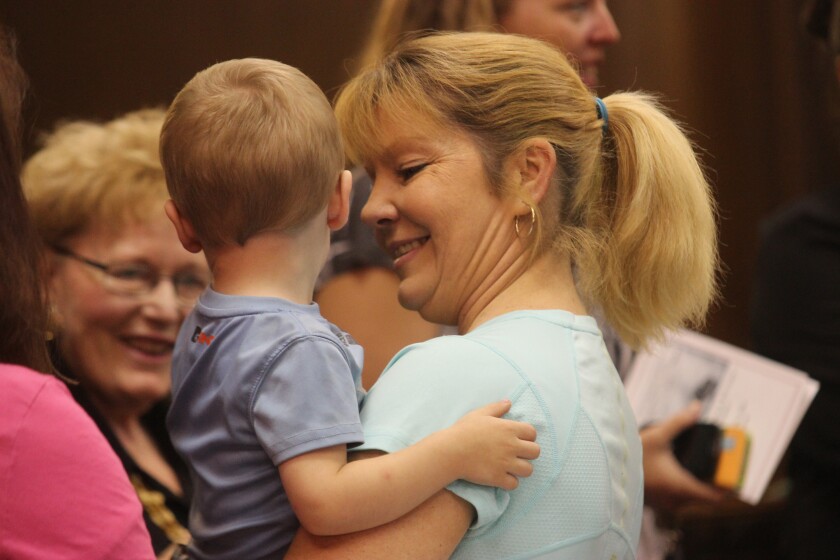 Amy Demaranville, right, celebrates her graduation from the James Valley Drug Court on Thursday at the Davison County Courthouse in Mitchell. (Jake Shama/Republic)