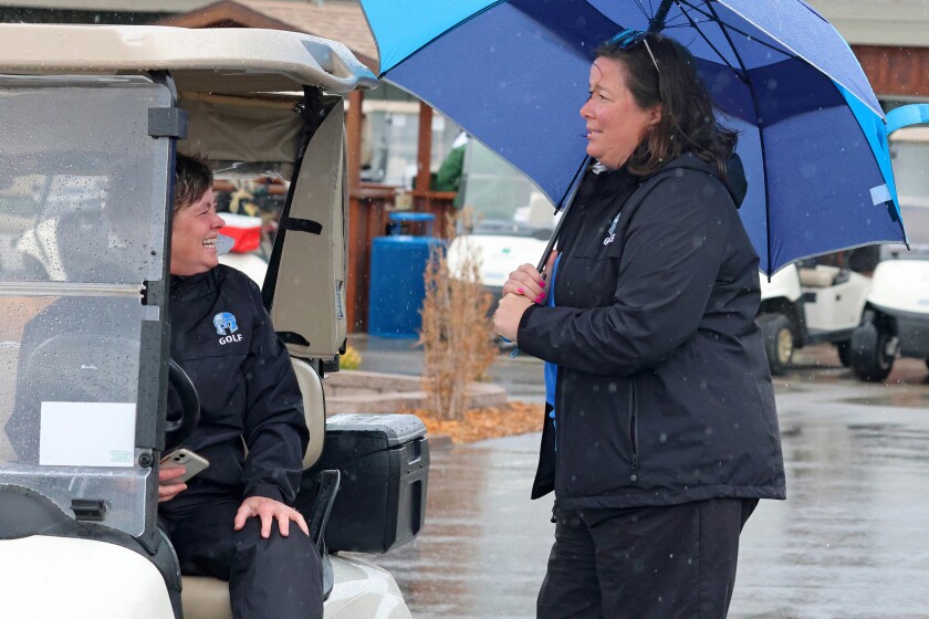 Brainerd coaches Jean Martin, left, and Karissa Haugen talk during the meet on Thursday, May 1, 2025, at at Pine Beach East Golf Course at Madden’s.