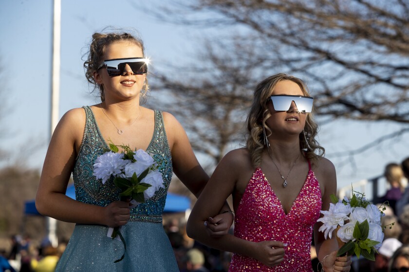 Willmar High School prom attendees walk before hundreds of friends and family members during grand march on Friday, May 6, 2022.