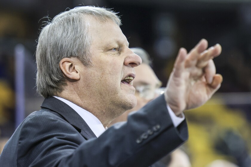 college men play ice hockey