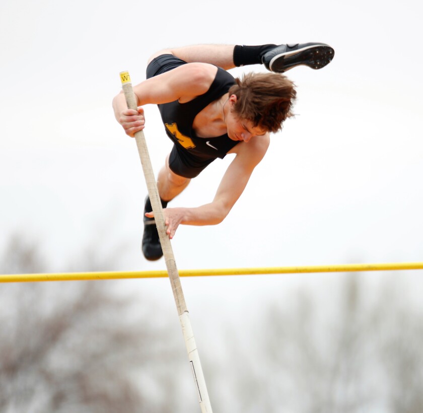 Mitchell's Sutton Carpenter competes in the pole vault during the Mitchell Triangular at Joe Quintal Field on Tuesday. (Ryan Deal / Republic)