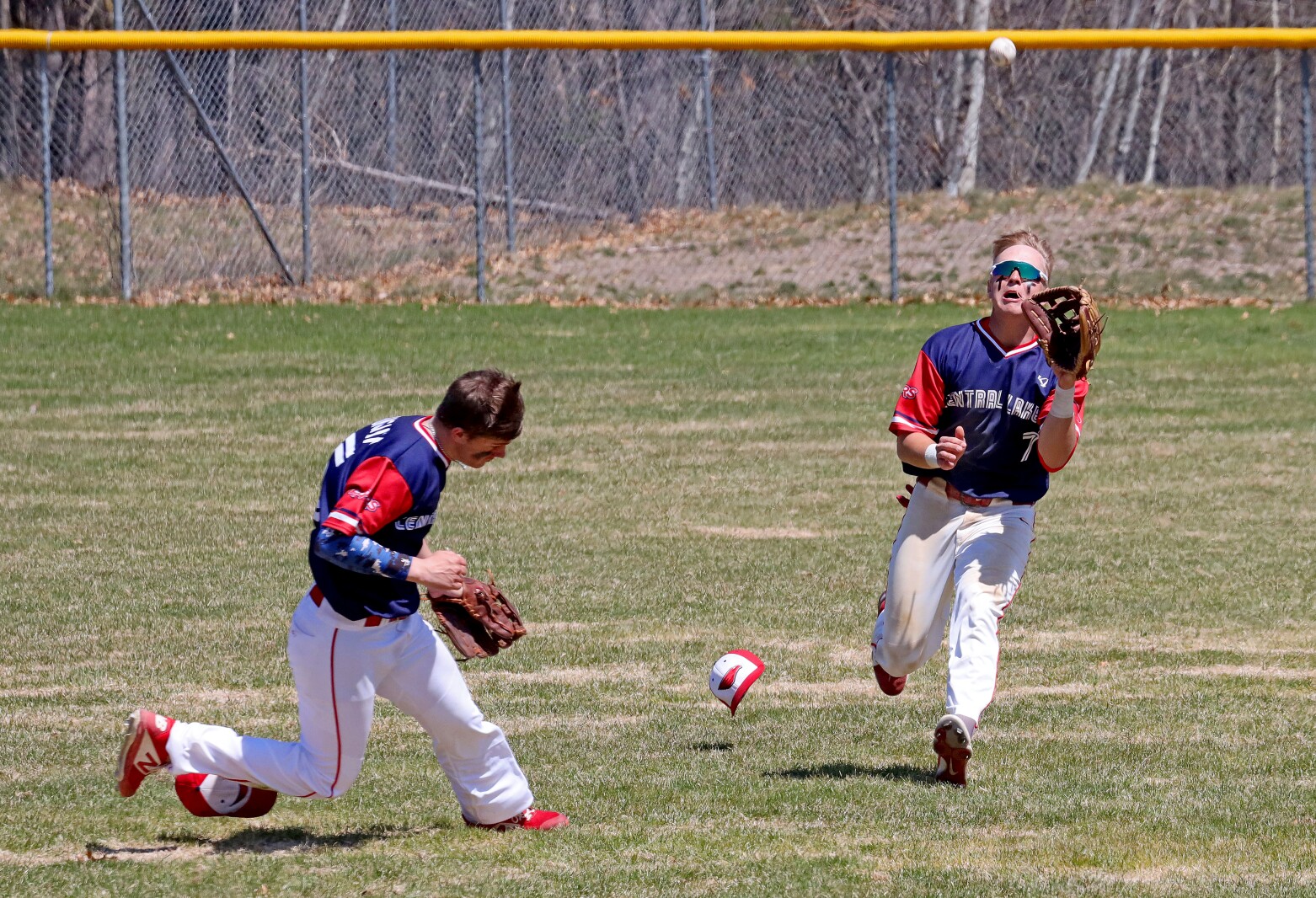 Central Lakes College's Erik Bungum, left, and Eli Roberts make a play in the outfield against Anoka-Ramsey Community College Friday, May 6, 2022, at Paul C. Findorff Athletic Complex in Brainerd.