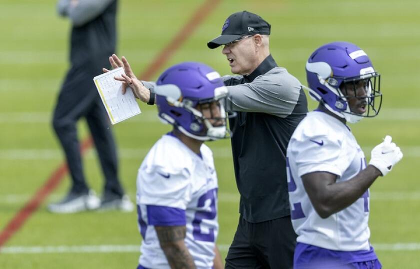 SPORTS-MORE-FREE-VIKINGS-DEFENDERS-ADJUSTING-1-MS.jpg