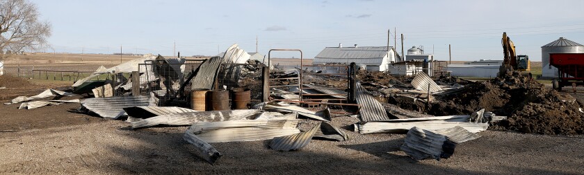 Rubble is left behind after fire destroyed three farm buildings Saturday northeast of Adrian.
