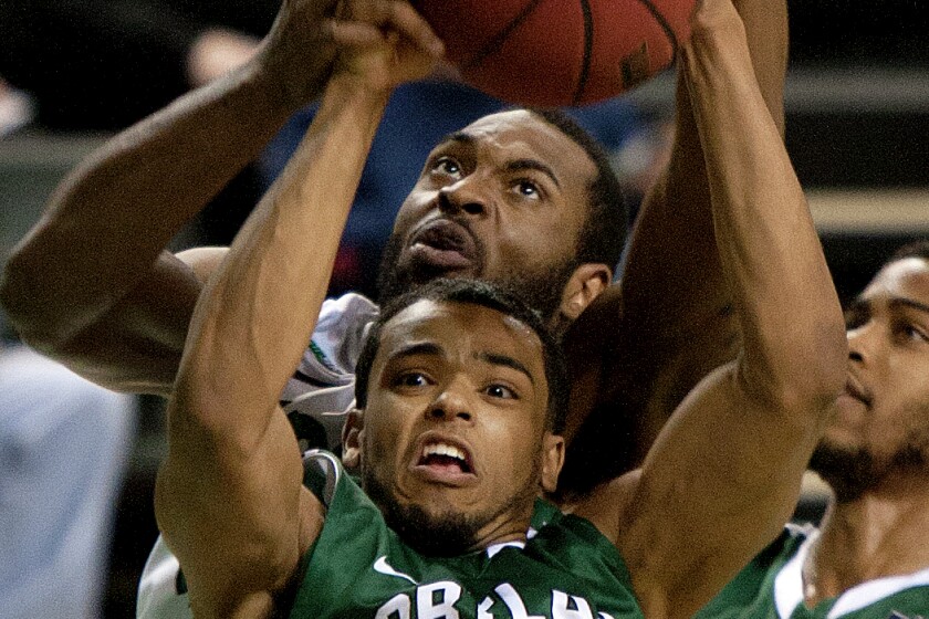 UND's Alonzo Traylor (top) fights Portland State's Tim Douglas