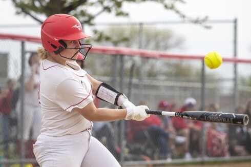 Willmar sophomore Lexi Owens hits an incoming pitch during a Section 8AAA playoff game against Sauk Rapids in Willmar on Tuesday, May 24, 2022.