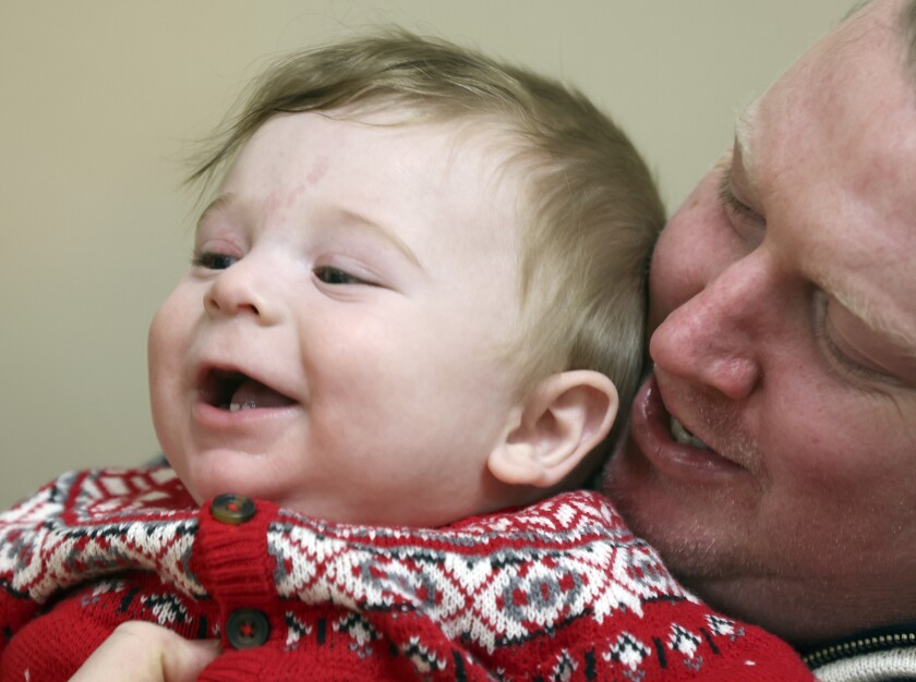 Father holding son