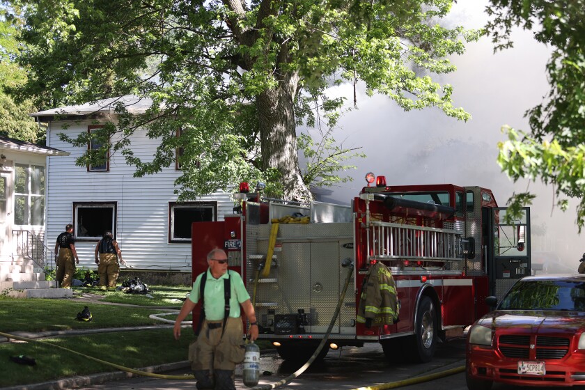 Worthington Fire Department battles house fire at 523 Strait Ave. Tuesday morning.