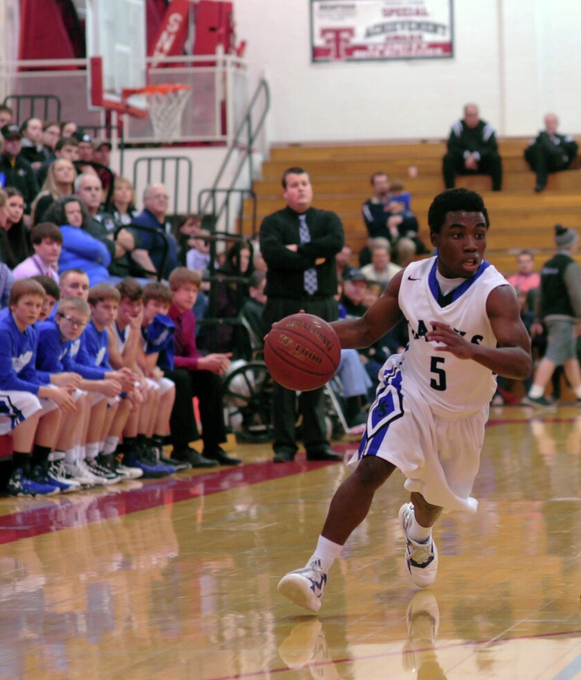 Hettinger-Scranton junior guard Isaiah Kludt dribbles the basketball against Mott-Regent during the Region 7 Tournament on March 6 at the Knights of Columbus Activities Center. (Samuel Evers / The Dickinson Press)