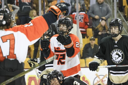 high school boys play ice hockey