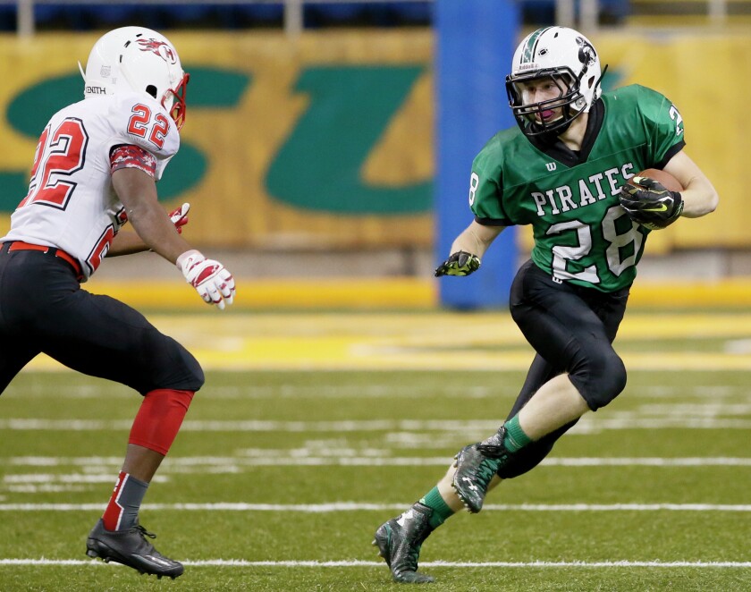 Taylor Willis, right, of Verndale is challenged by Sam Ihrke of Hillcrest Lutheran Academy during their Minnesota 9-man, Section 4 championship football game Friday in Fargo. Michael Vosburg / Forum Photo Editor