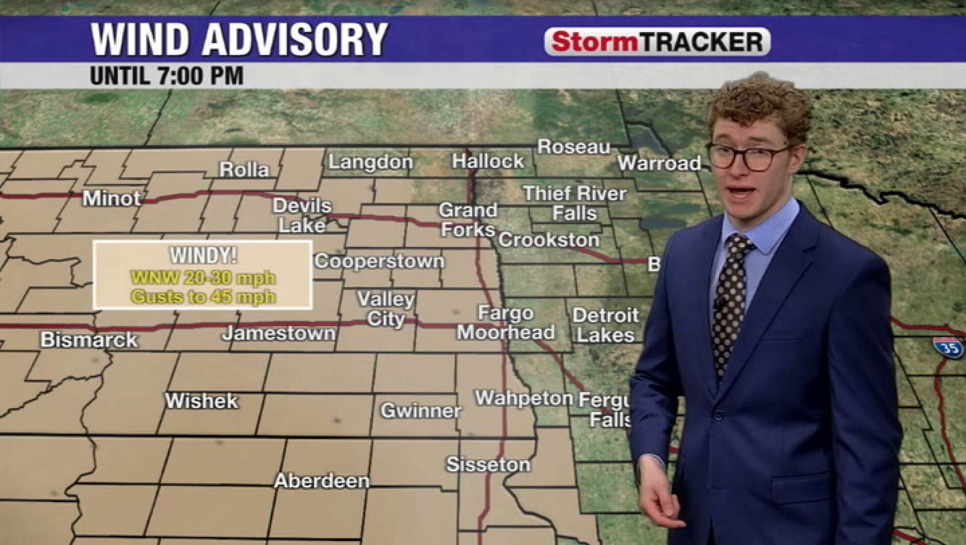 Blustery with rain/snow continuing to track east this evening ...