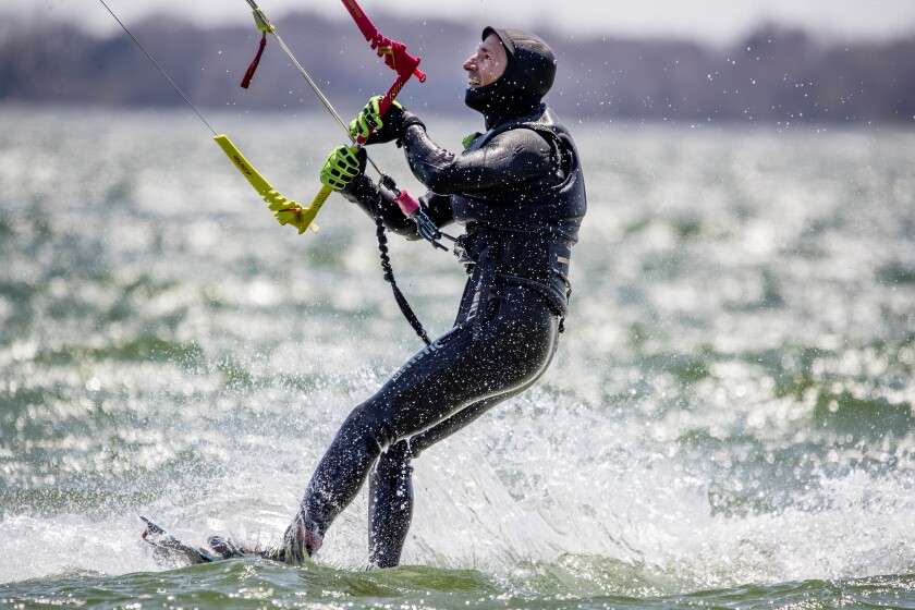 Victor Ruotti of Madison, Wisconsin enjoys winds between 20 and 30 miles per hour as he and his friends spent the afternoon kitesurfing along Green Lake outside Spicer on Saturday, May 7, 2022 .