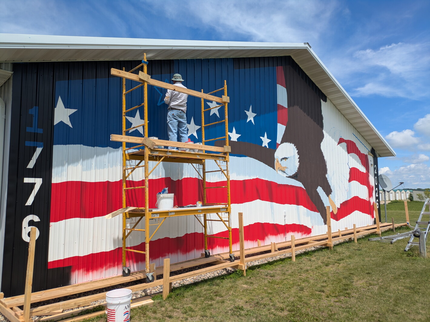 Patriotic painting overlooks highway near Spicer, Minnesota, in time for 4th