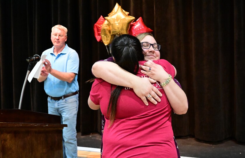 Two people hugging