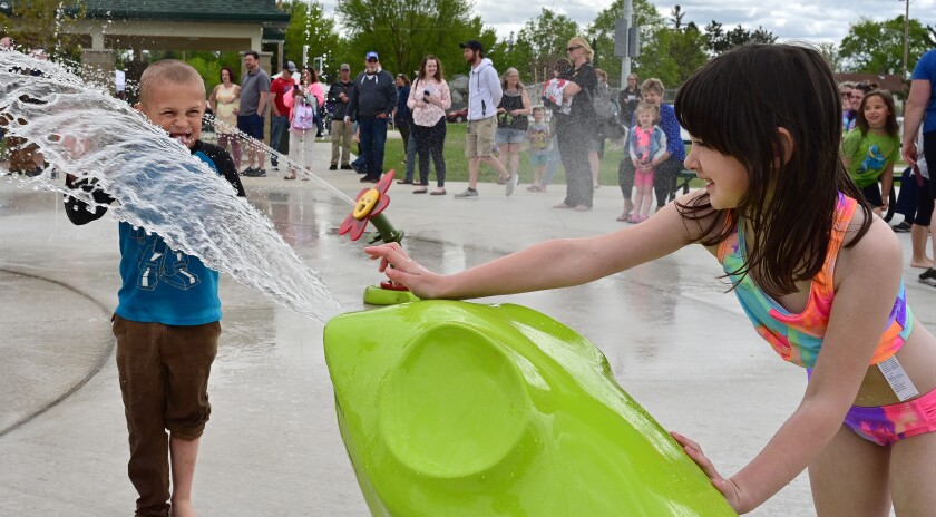 Children play in the water at the splashpad.