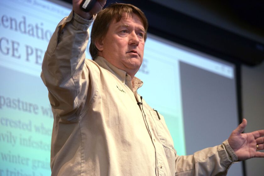 Kevin Sedivec, rangeland specialist and director of the North Dakota State University Central Grasslands Research Extension Center, warns ranchers against overgrazing during the Farming and Ranching for the Bottom Line conference held in Bismarck Tuesday, Feb. 27, 2018. Jessica Holdman / Bismarck Tribune