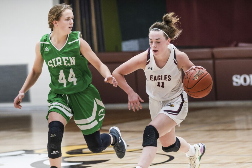 high school girls playing basketball