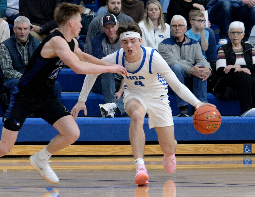 Heritage Christian Academy senior Owen Haag, right, tries to dribble past CMCS' Jake Ver Steeg during a non-conference game on Saturday, Dec. 14, 2024 at Prinsburg.
