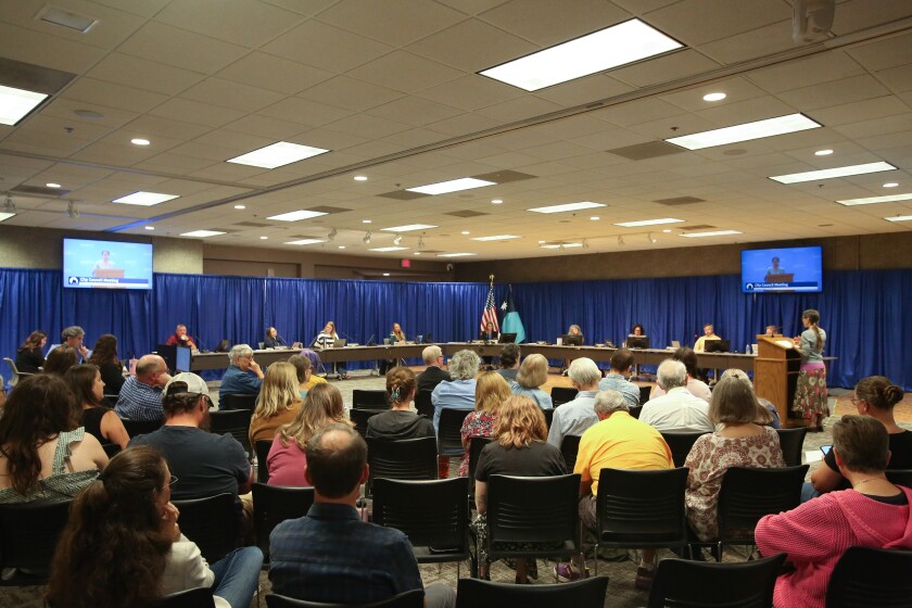 Jen Walla speaks during a Moorhead City Council meeting at the Hjemkomst Center on Monday, Aug. 11, 2025, about aerial spraying for mosquitoes. The city was supposed to spray for mosquitoes. The city postponed spraying after residents spoke out against it.