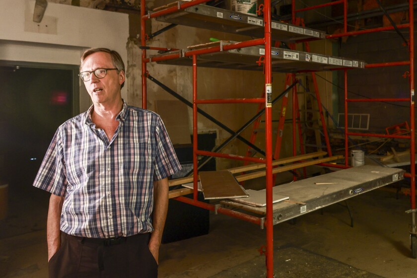 Ornate plaster details inside historic theater under restoration