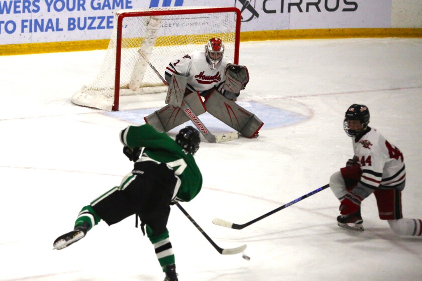 Boys playing hockey.