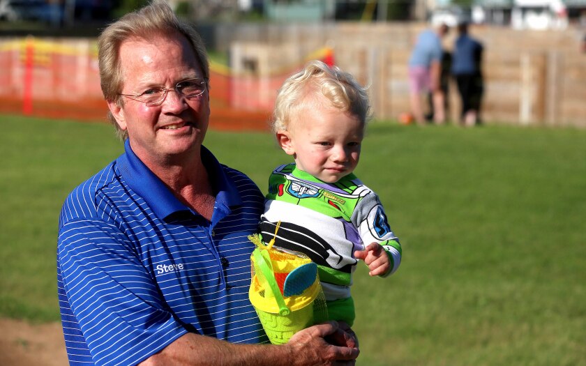 Man holds grandson