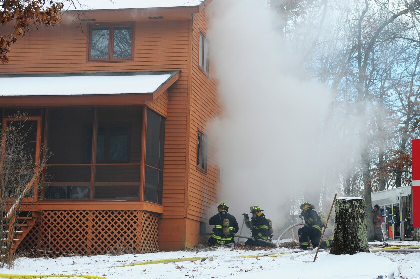Pequot Lakes firefighters battle a house fire on the 28000 block of Crow Wing County Road 107 Friday morning. Nisswa, Pine River and Ideal Fire Departments also responded to the fire. Brainerd Dispatch/Steve Kohls