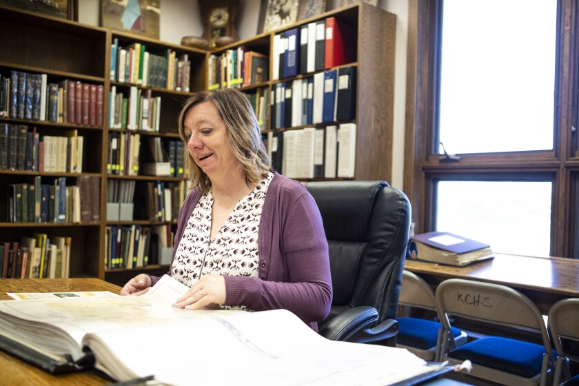 Kandiyohi County Historical Society executive director Jill Wohnoutka flips through historical documents on hand at the Willmar-based museum on Thursday, July 28, 2022.