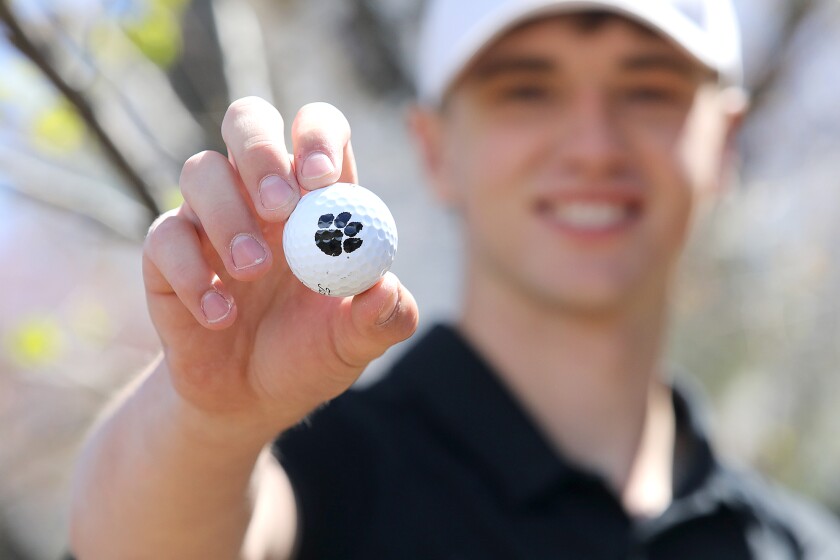 Trent Meyer holds a Tiger golf ball