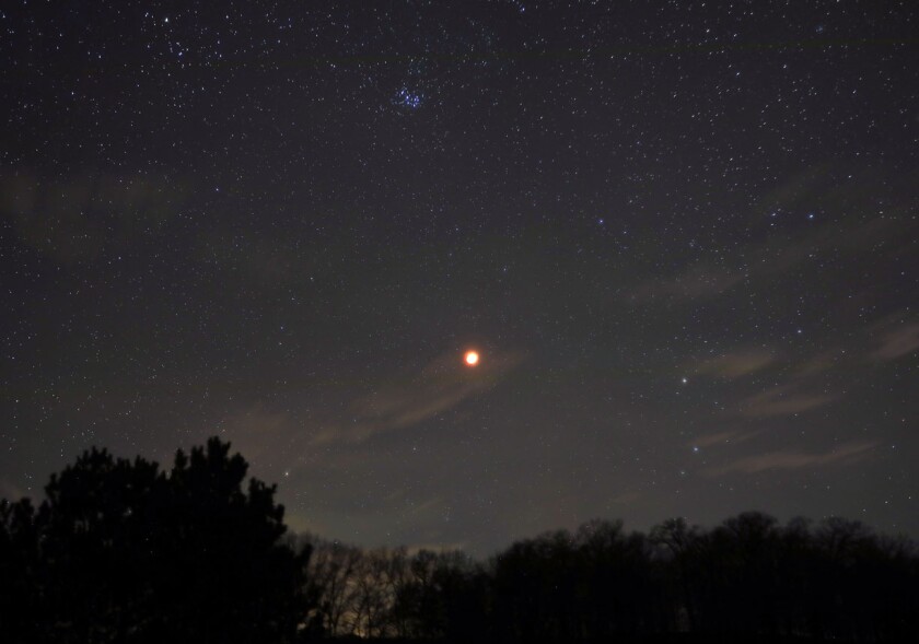 Eclipsed moon and Pleiades