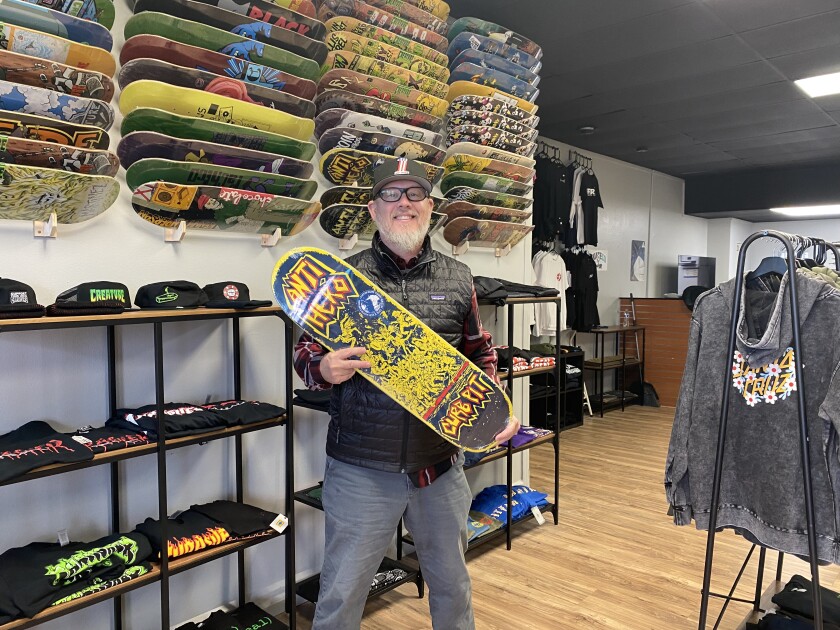 Anton "Andy" Dabbs the owner of Brainerd Skate Company poses for a photo.