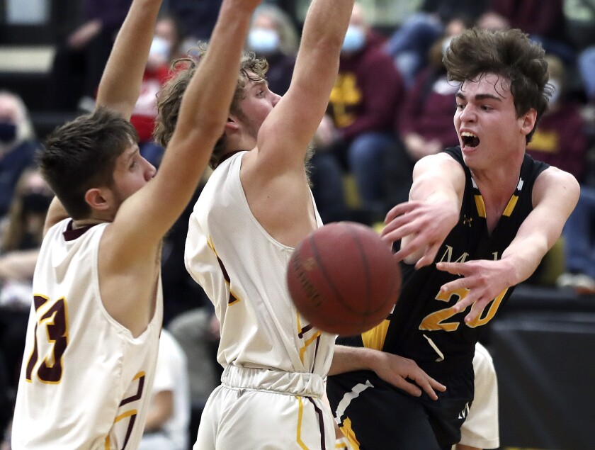 Basketball player passes the ball.