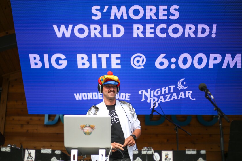 Blaine "DJDizzyB" Booher, DJs for the crowd at the Night Bazaar event on Thursday, July 24, 2025, in downtown Fargo.