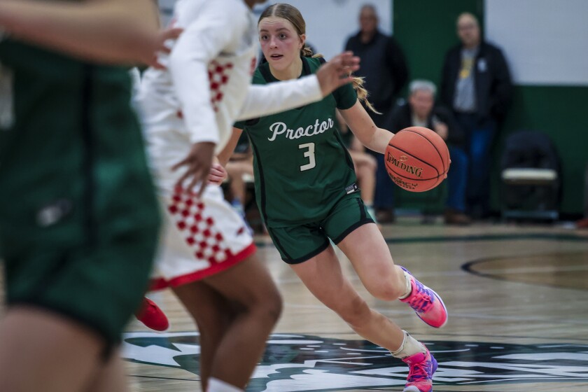 high school girls play basketball