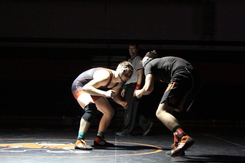 Dickinson High junior wrestler Kameron Clark in action with Williston's Joe Pacheco on Dec. 15 at DHS gym. (Shelby Reardon / The Dickinson Press)