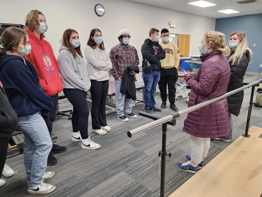 Students tour the gym at Sanford Worthington Therapy and Rehabilitation as part of Minnesota West Community and Technical College's Nursing & OTA Camp Wednesday, Dec. 7, 2022. Kara Kramer, right, and Alyssa DeKay, second from the right, tell the students about the work they do.