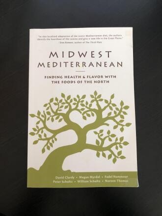 A book titled "Midwest Mediterranean" features a green silhouette of an olive tree on a white cover.